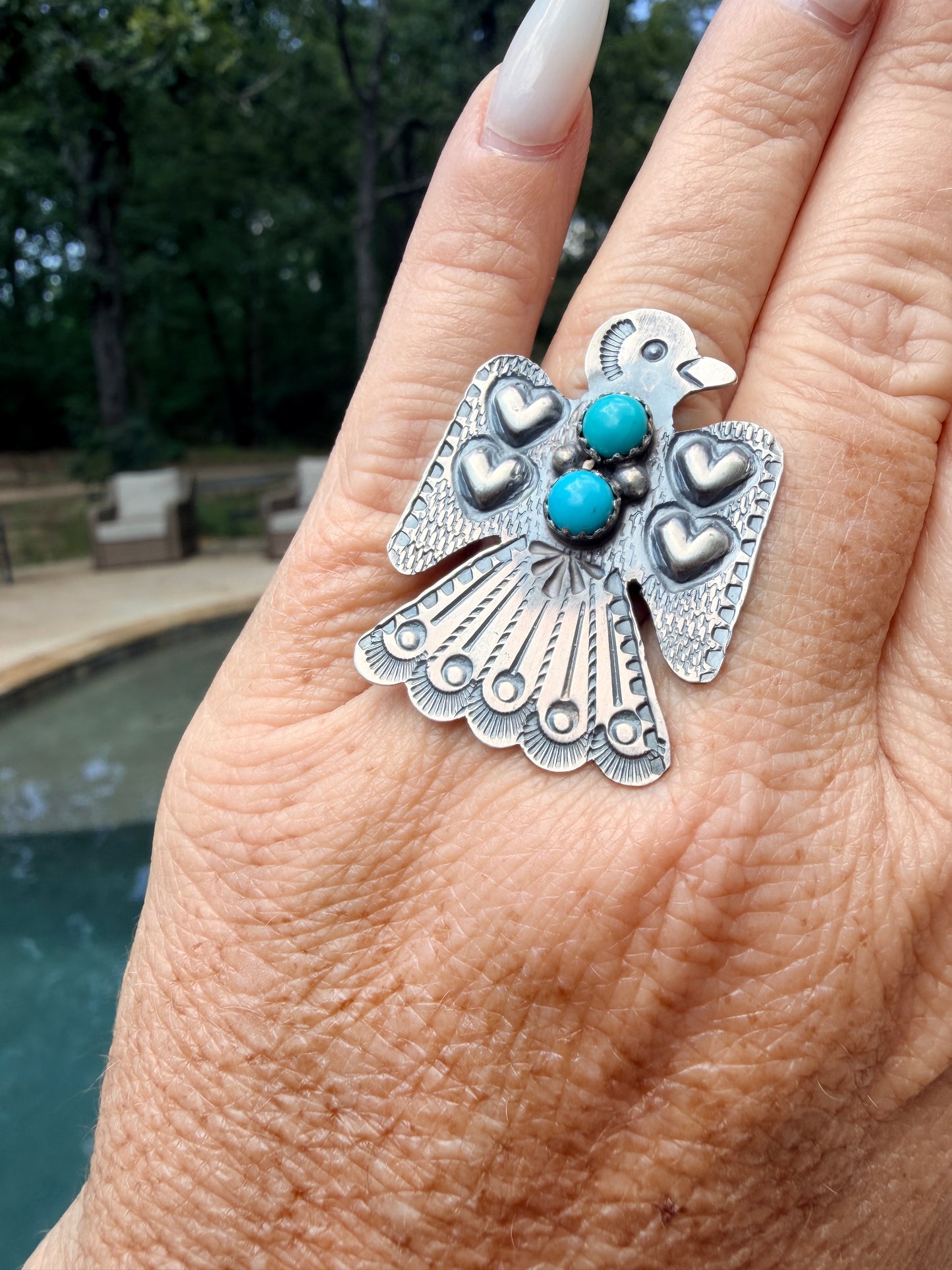 Adjustable Thunderbird Ring with Turquoise and Detailed Stamping